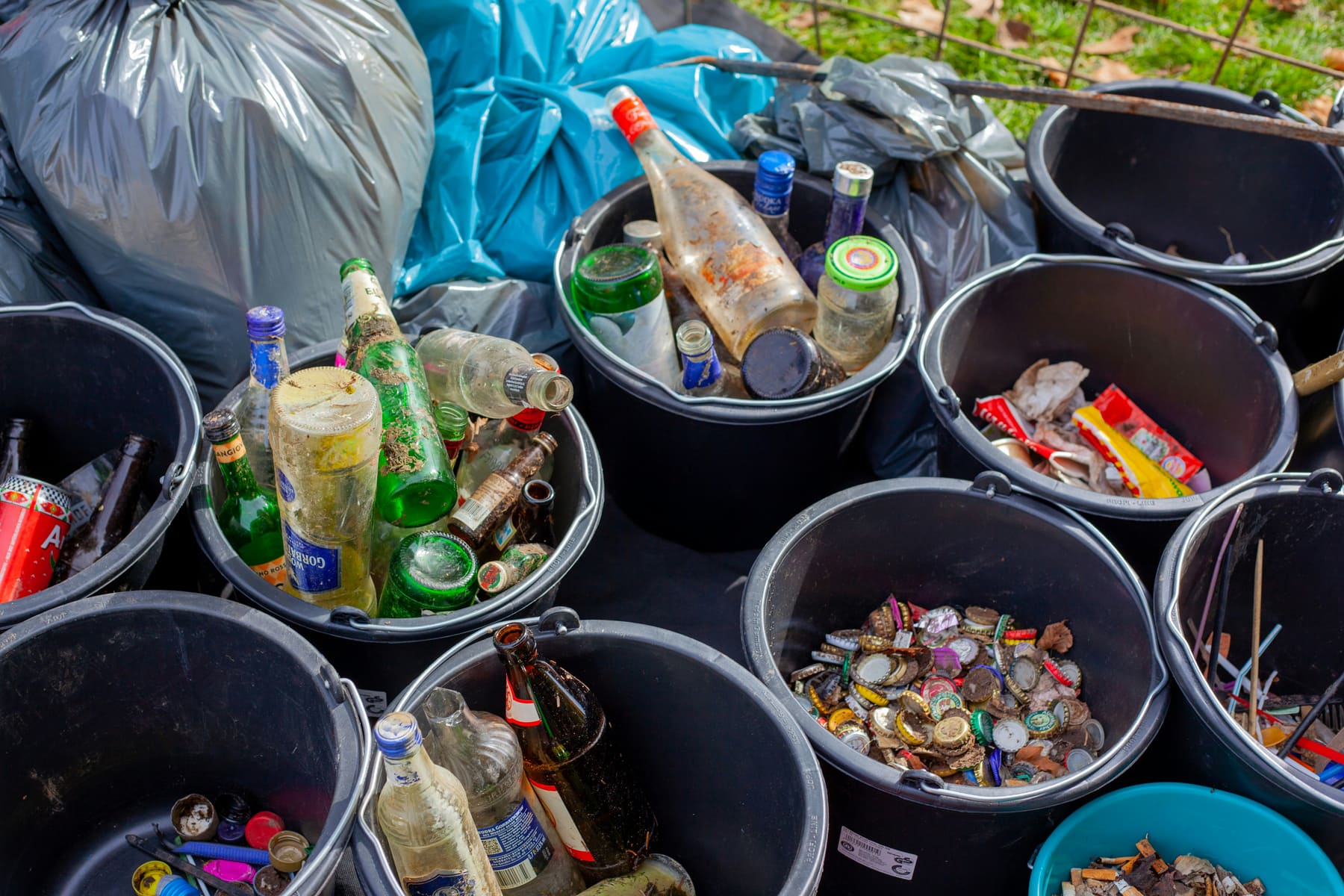 Buckets of collected bottles and caps ready for sorting